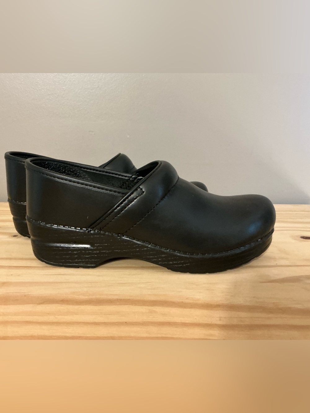Dansko Black Leather Professional Classic Slip-On Clog in Narrow Width